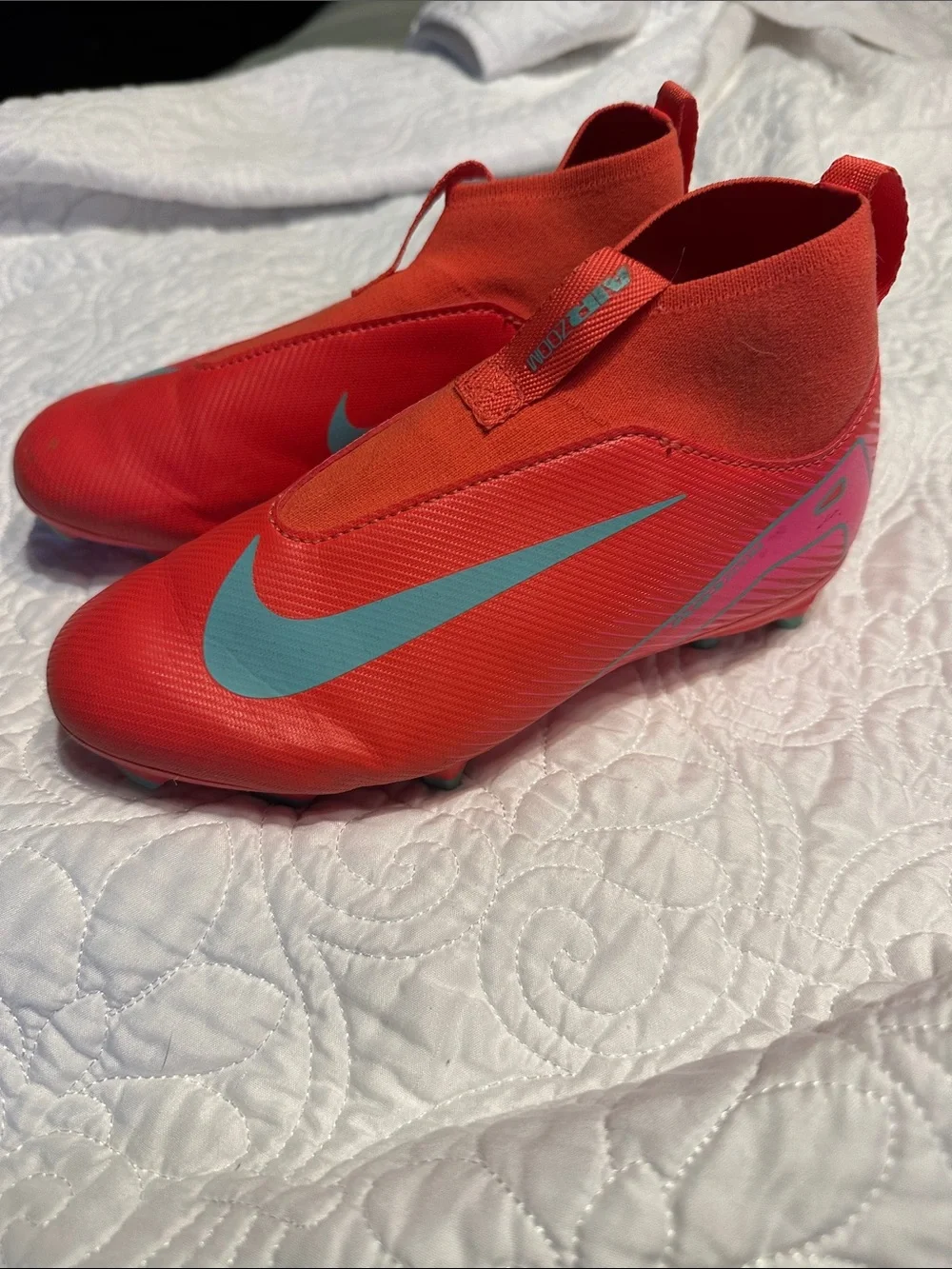 Nike Kids Red Soccer Cleats with Teal Swoosh